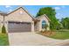 Charming home featuring a lush green lawn and a two car attached garage at 1053 Beechcraft Dr # 124, Mebane, NC 27302