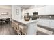 Spacious kitchen featuring a large island with barstool seating and stainless steel appliances at 1053 Beechcraft Dr # 124, Mebane, NC 27302