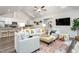 Spacious living room open to the kitchen, featuring hardwood floors and modern decor at 1053 Beechcraft Dr # 124, Mebane, NC 27302
