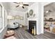 Charming living room with fireplace, hardwood floors, and natural light at 1053 Beechcraft Dr # 124, Mebane, NC 27302