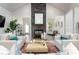 Bright living room featuring a stone fireplace, vaulted ceilings and white furniture at 1053 Beechcraft Dr # 124, Mebane, NC 27302