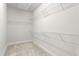 Spacious walk-in closet with wire shelving to maximize storage and organization for optimal efficiency at 1053 Beechcraft Dr # 124, Mebane, NC 27302