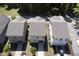 A serene aerial view captures the community, showcasing homes nestled among lush greenery and quiet streets at 109 Belle Plain Dr, Morrisville, NC 27560
