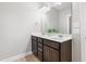 Bathroom featuring double sinks with granite countertops and a dark wood vanity at 109 Belle Plain Dr, Morrisville, NC 27560