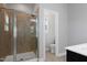 Bathroom with a glass-enclosed shower, neutral tile, and access to the water closet at 109 Belle Plain Dr, Morrisville, NC 27560