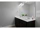 Bathroom featuring a double vanity with modern fixtures, a large mirror, and neutral paint at 109 Belle Plain Dr, Morrisville, NC 27560