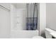 Bathtub with a shower curtain with decorative circles and geometric patterns at 109 Belle Plain Dr, Morrisville, NC 27560