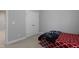 Neutral bedroom featuring carpet and a closet with bi-fold doors, creating a calm and organized space at 109 Belle Plain Dr, Morrisville, NC 27560