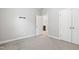 Spacious bedroom with neutral carpet and a view into the adjoining bathroom at 109 Belle Plain Dr, Morrisville, NC 27560