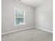 Neutral bedroom with ample sunlight shining through the white blinds at 109 Belle Plain Dr, Morrisville, NC 27560