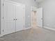 Spacious carpeted bedroom with adjoining closet and doorway at 109 Belle Plain Dr, Morrisville, NC 27560