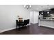 Inviting dining area with contemporary lighting and a modern table setting, open to the kitchen at 109 Belle Plain Dr, Morrisville, NC 27560