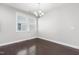 Dining room with window, chandelier and dark-stained wood floors at 109 Belle Plain Dr, Morrisville, NC 27560