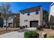 Two-story home with a brown garage door, neutral siding, and manicured landscaping at 109 Belle Plain Dr, Morrisville, NC 27560