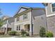 Charming two-story home boasts lovely exterior architecture with tasteful landscaping and a welcoming front entrance at 109 Belle Plain Dr, Morrisville, NC 27560