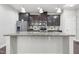 Island in the kitchen featuring a sink and stone countertops at 109 Belle Plain Dr, Morrisville, NC 27560