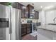 Kitchen with stainless steel appliances and dark wood cabinets at 109 Belle Plain Dr, Morrisville, NC 27560