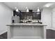 Spacious kitchen featuring a large center island, stainless steel appliances, and ample cabinetry at 109 Belle Plain Dr, Morrisville, NC 27560