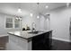 Open concept kitchen with granite countertops and a large center island, great for entertaining at 109 Belle Plain Dr, Morrisville, NC 27560