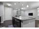 Kitchen island with a granite countertop, stainless steel dishwasher, pendant lights, and an open view into the living space at 109 Belle Plain Dr, Morrisville, NC 27560