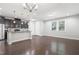 Open kitchen design with stainless steel appliances and an island, connected to a dining space at 109 Belle Plain Dr, Morrisville, NC 27560