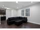 Modern living room with dark hardwood floors, ample natural light, and contemporary furnishings at 109 Belle Plain Dr, Morrisville, NC 27560
