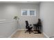 Functional carpeted office area with modern desk setup and natural light, designed for productivity at 109 Belle Plain Dr, Morrisville, NC 27560