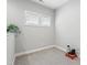 Cozy carpeted room with natural light, a plant, and wired electronic accessories at 109 Belle Plain Dr, Morrisville, NC 27560