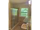 Bathroom with shower and window providing natural light at 1115 Park Ave, Henderson, NC 27536
