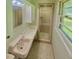 Bathroom with tile floors, shower and vanity at 1115 Park Ave, Henderson, NC 27536