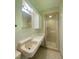 Bathroom with tile floors, shower and vanity at 1115 Park Ave, Henderson, NC 27536