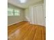 Bedroom with hardwood floors and a double door closet at 1115 Park Ave, Henderson, NC 27536