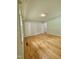 Bright bedroom features hardwood floors, natural light, and neutral walls at 1115 Park Ave, Henderson, NC 27536