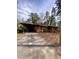 View of home's driveway with attached carport, offering covered parking and convenience at 1115 Park Ave, Henderson, NC 27536