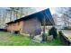 Exterior of the home with backyard lawn and covered patio, perfect for outdoor entertaining at 1115 Park Ave, Henderson, NC 27536
