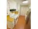 Efficient kitchen layout with bright white cabinetry and modern appliances at 1115 Park Ave, Henderson, NC 27536