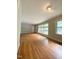 Bright and airy living room with hardwood floors and large windows at 1115 Park Ave, Henderson, NC 27536