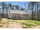 Back exterior view of home, showcasing deck, neutral siding, and expansive backyard at 139 Oswego Dr, Louisburg, NC 27549