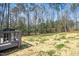 Sprawling backyard with wooded privacy and a deck offering relaxation at 139 Oswego Dr, Louisburg, NC 27549
