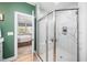 Elegant bathroom featuring a frameless glass shower with marble tile and a built-in bench at 139 Oswego Dr, Louisburg, NC 27549