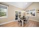 Bright dining room with a modern chandelier and sliding doors to the outdoor deck at 139 Oswego Dr, Louisburg, NC 27549