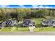 An eye-level shot of well-maintained homes with inviting curb appeal nestled in a serene residential area at 147 Everwood Dr, Four Oaks, NC 27524