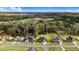 Beautiful aerial view of the home surrounded by lush greenery and other houses at 147 Everwood Dr, Four Oaks, NC 27524