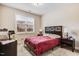 Cozy bedroom featuring a comfortable bed with side tables and a window with blind at 147 Everwood Dr, Four Oaks, NC 27524