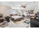 Spacious bedroom with comfortable bed, ceiling fan, and decorated wall with poster art at 147 Everwood Dr, Four Oaks, NC 27524