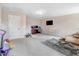 Bonus room with potential for multiple uses, features carpet and ample natural lighting at 147 Everwood Dr, Four Oaks, NC 27524