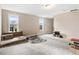 Spacious bonus room with ample natural light, carpeting, and the potential for a variety of uses at 147 Everwood Dr, Four Oaks, NC 27524