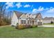 Beautiful home with green grass and manicured bushes at 147 Everwood Dr, Four Oaks, NC 27524