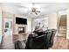 Cozy living room featuring a fireplace, hardwood floors, and an adjacent dining area at 147 Everwood Dr, Four Oaks, NC 27524