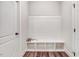 Bright and functional mudroom with built-in bench, cubbies, and beadboard paneling at 147 Everwood Dr, Four Oaks, NC 27524